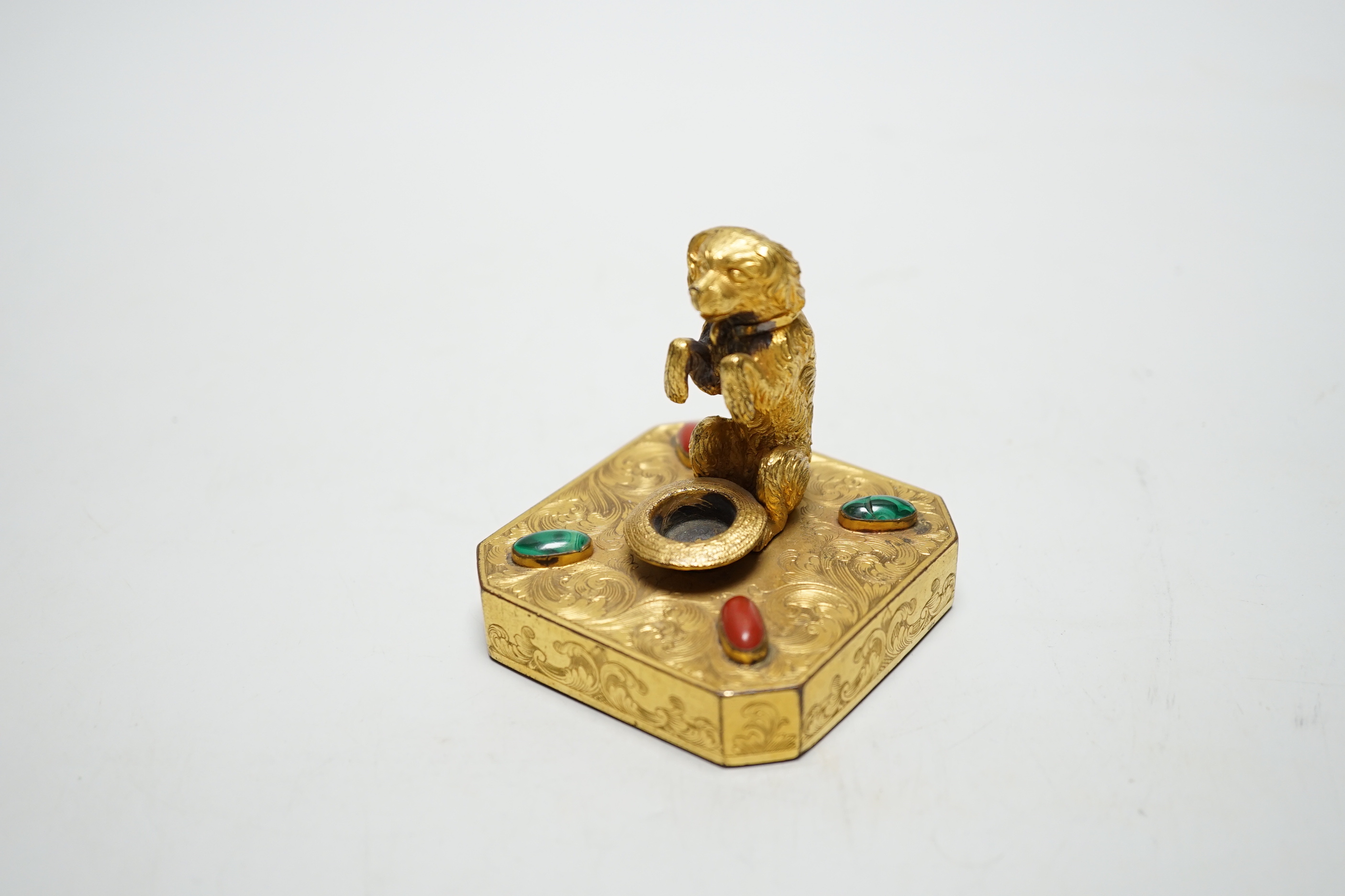 A 19th century Palais Royal ormolu ‘begging dog’ taper holder, 7cm